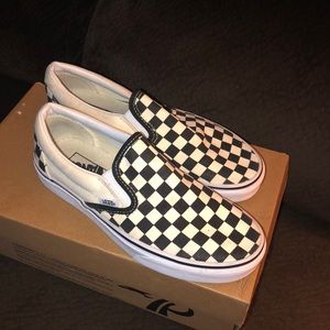 Black and white checkered Vans.